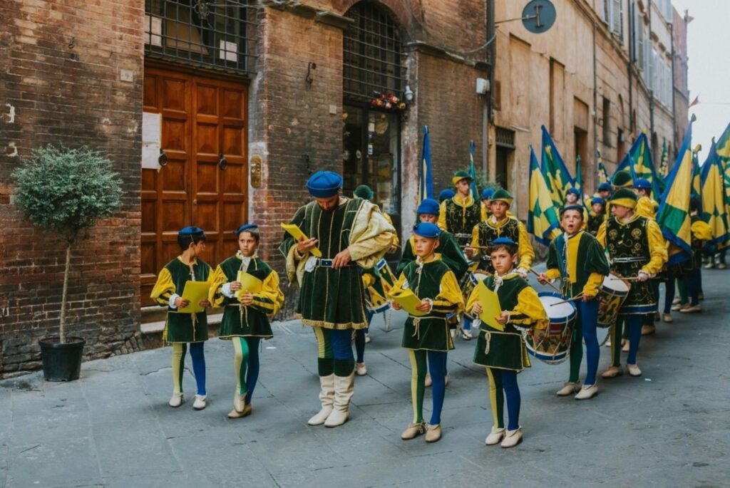 Parade guide marchers in traditional Irish uniforms with bagpipes during NYC St. Patrick's Day celebration