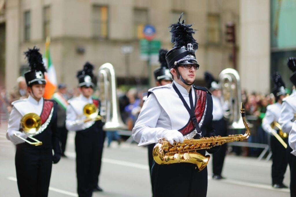 Parade guide viewing locations along NYC Fifth Avenue with spectators watching St. Patrick's Day event