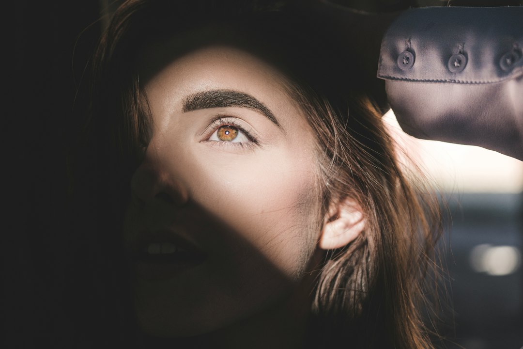 Client getting brow threading done at a Manhattan salon