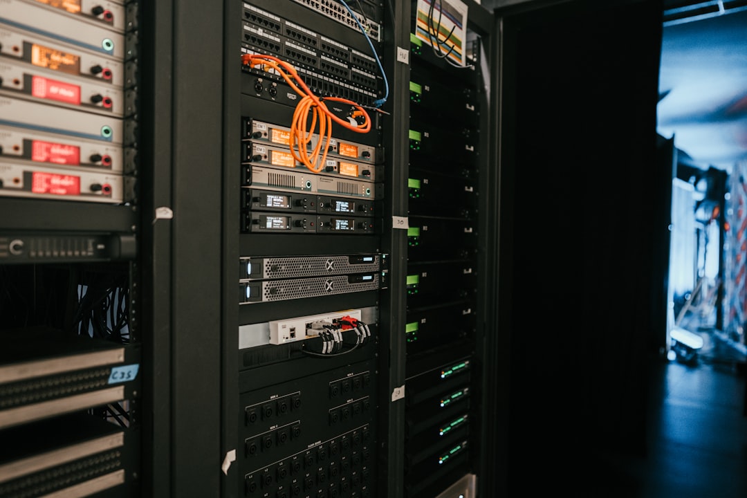 IT technician auditing least privilege permissions in a server room