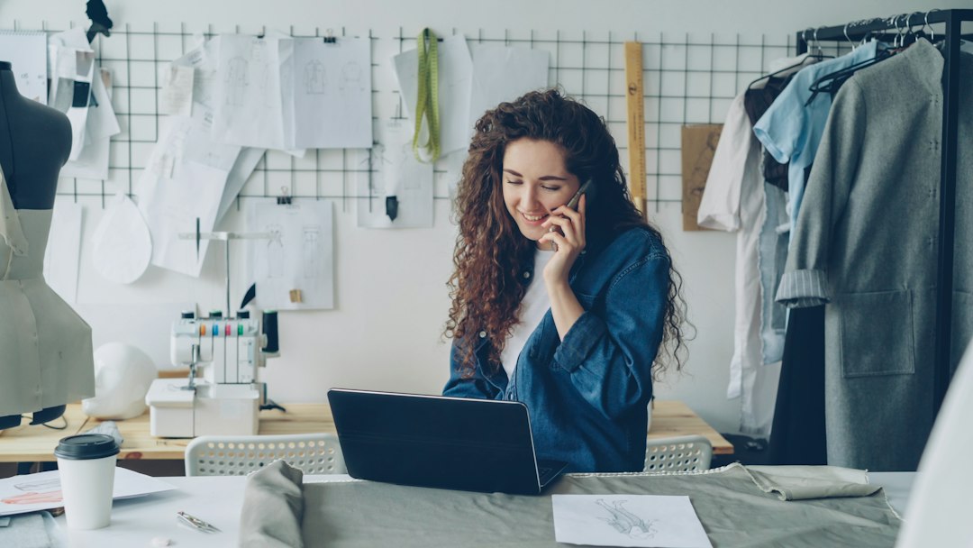 Small business owner checking traffic spike analytics on a laptop