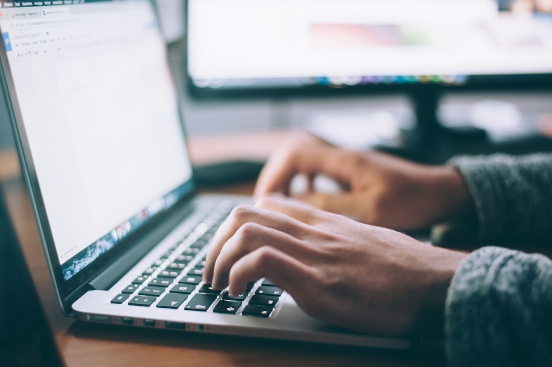 Small business owner reviewing list cleaning results on a laptop
