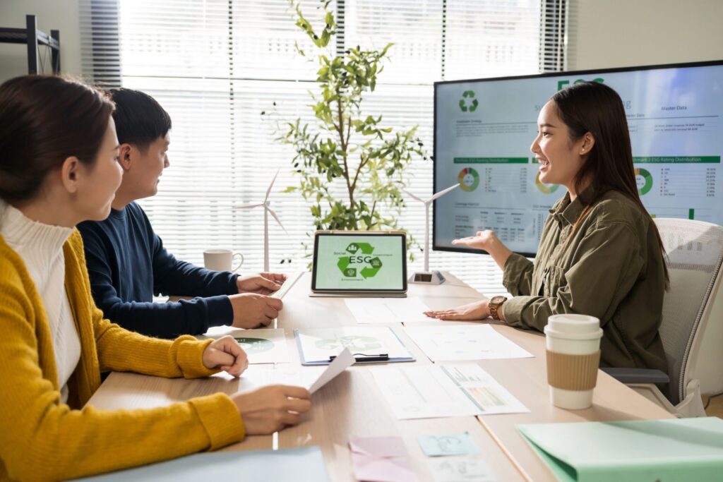 Hotel team implementing sustainability practices through collaborative CSR strategy planning