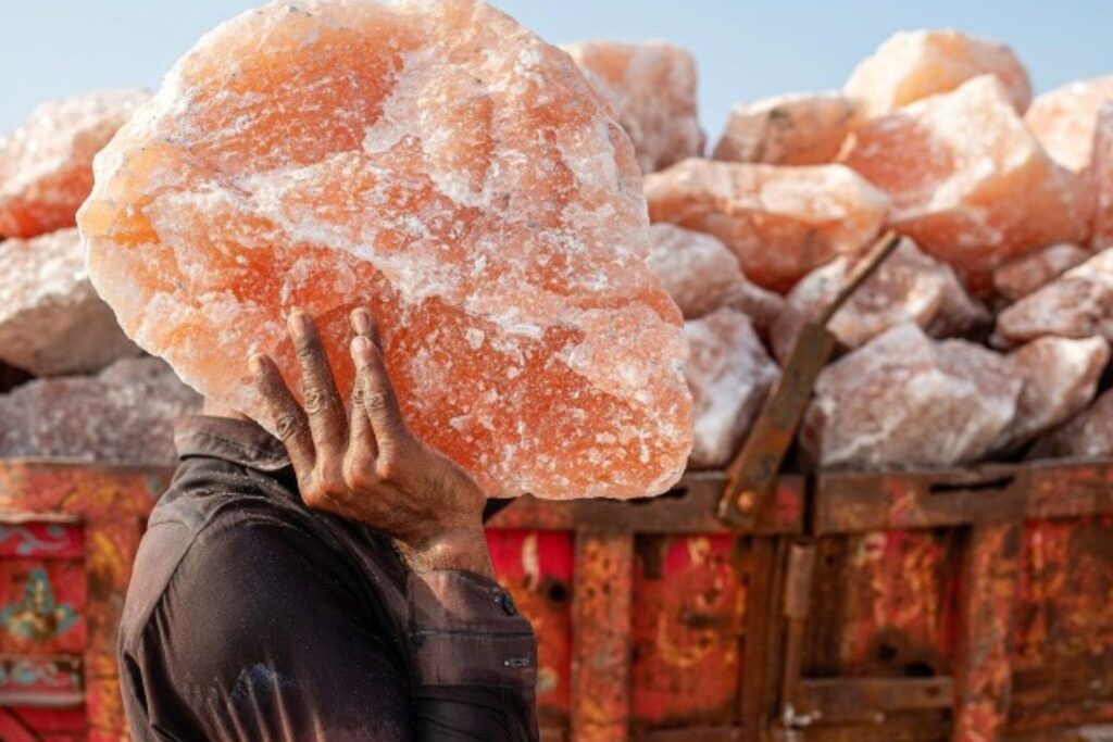 _Traditional workers hand-mining pink salt using ancient techniques preserving natural minerals and cultural heritage