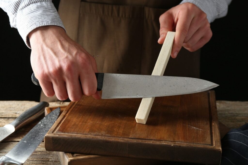Professional knife selection maintenance with chef sharpening essential kitchen equipment properly
