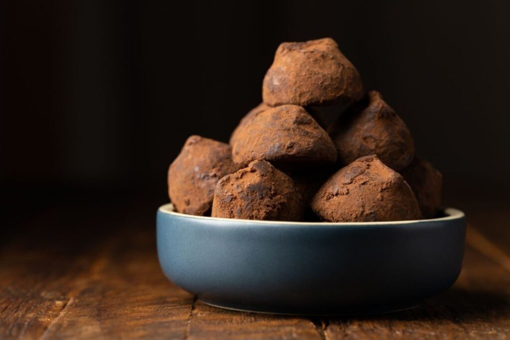 Professional chocolate tempering results with homemade truffles demonstrating proper technique methods