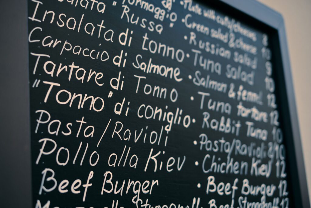 Chalkboard restaurant menu featuring seasonal summer ingredients and local produce