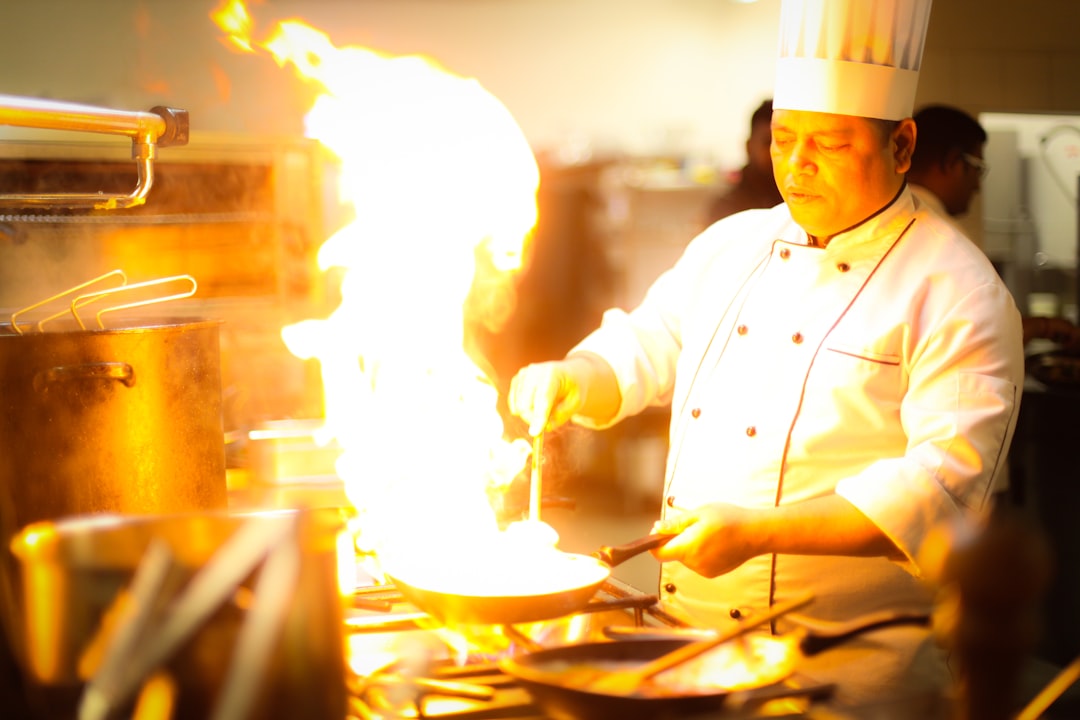 A cook demonstrates a heritage culinary technique in a hotel kitchen as part of a destination-led dining programme