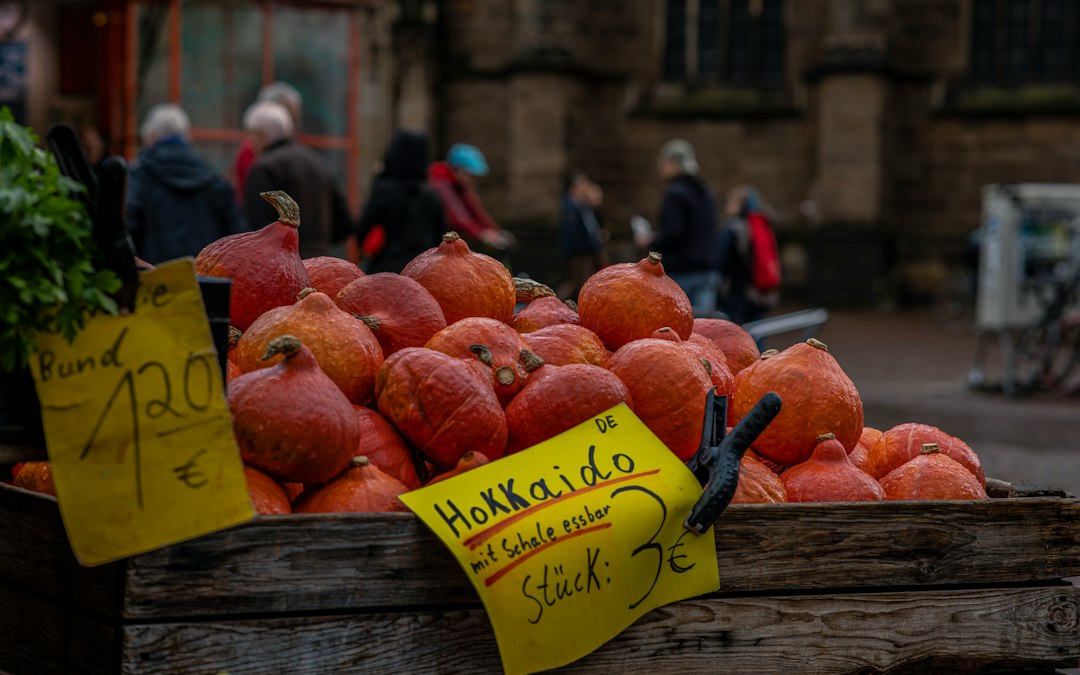 Market vendor selling pumpkins used for pumpkin soup
