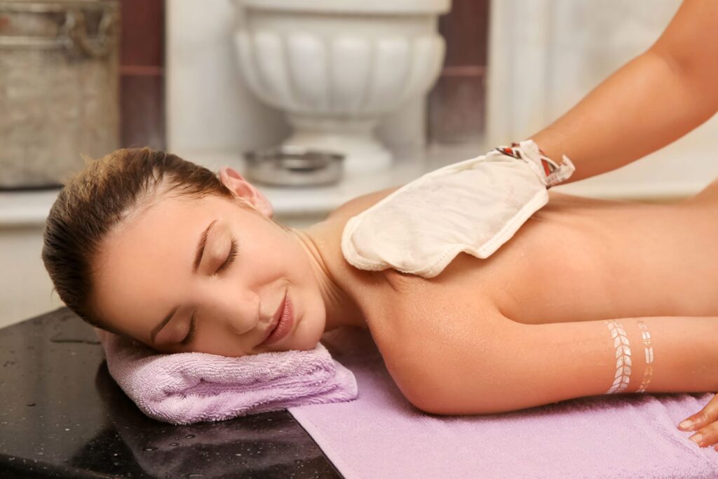 Authentic testimonial hammam experience showing woman enjoying traditional Moroccan steam therapy and wellness transformation