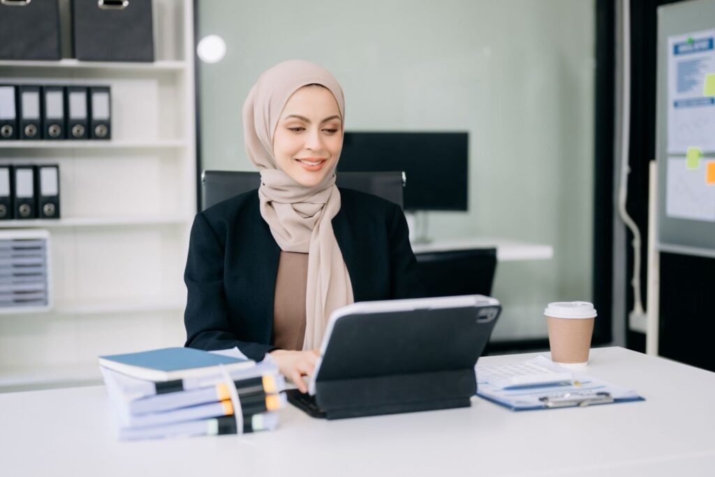 Female entrepreneurs collaborating on startup projects in a modern office environment, representing women leaders transforming Morocco's business innovation ecosystem