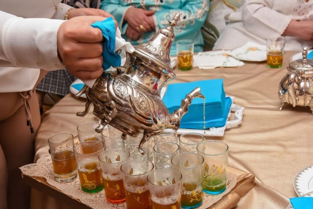 Traditional Moroccan mint tea ceremony representing daily mindful intentions practice through wellness ritual emphasizing presence, gratitude, and community support for sustainable 2026 transformation