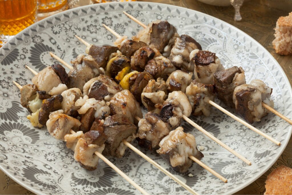 Moroccan family celebrating Eid al-Adha sacrifice with lamb skewers