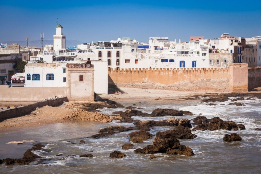 Blue and white walls of the UNESCO-listed Essaouira medina overlooking the Atlantic ocean, host city of the Gnaoua Festival