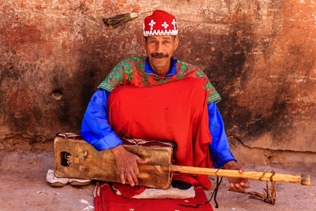 A Maâlem Gnaoua master musician performing with traditional instruments at the Gnaoua Festival Essaouira Morocco