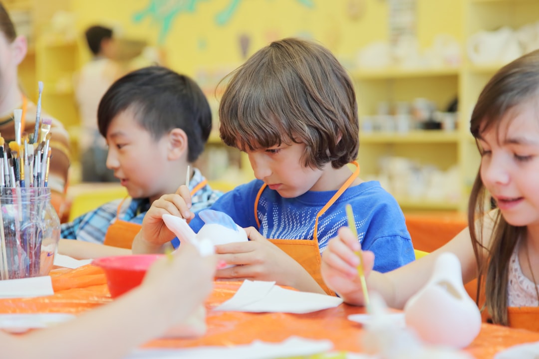 children pottery in a cool indoor workshop space,  best activities to keep kids cool during Morocco's hottest midday hours.