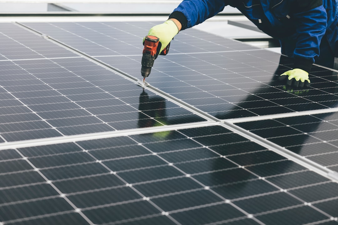 A worker in safety gear at a renewable energy installation in Morocco's southern provinces