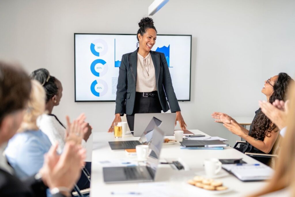 Female executive leading boardroom presentation business leaders CEO leadership executive innovation