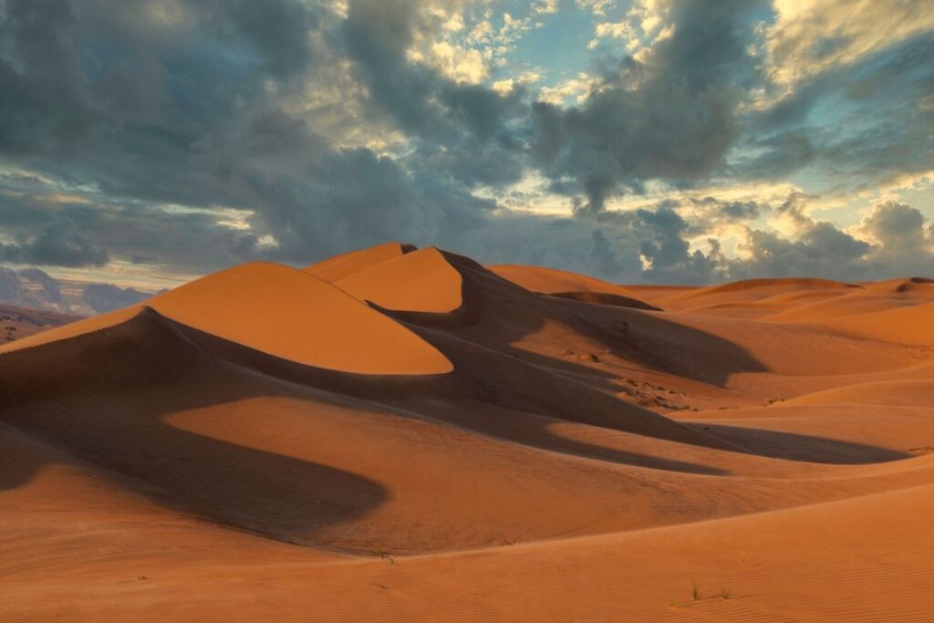Golden sand dunes at Wahiba Sands Oman desert road trip adventure drive wadi