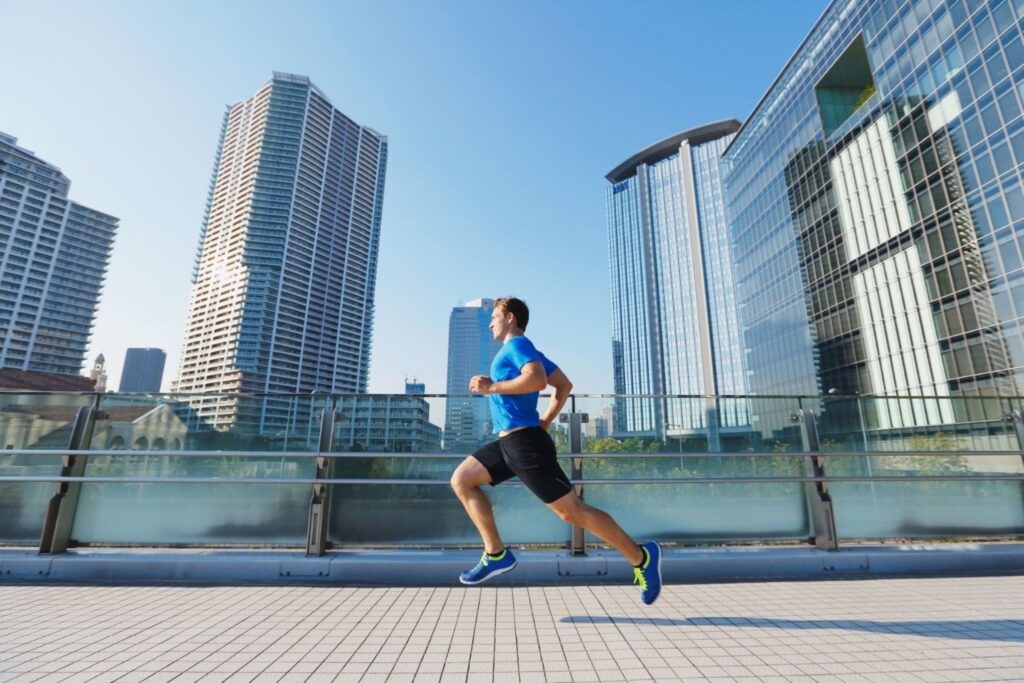 Runners participating in Dubai Run along Sheikh Zayed Road fitness challenge wellness active community