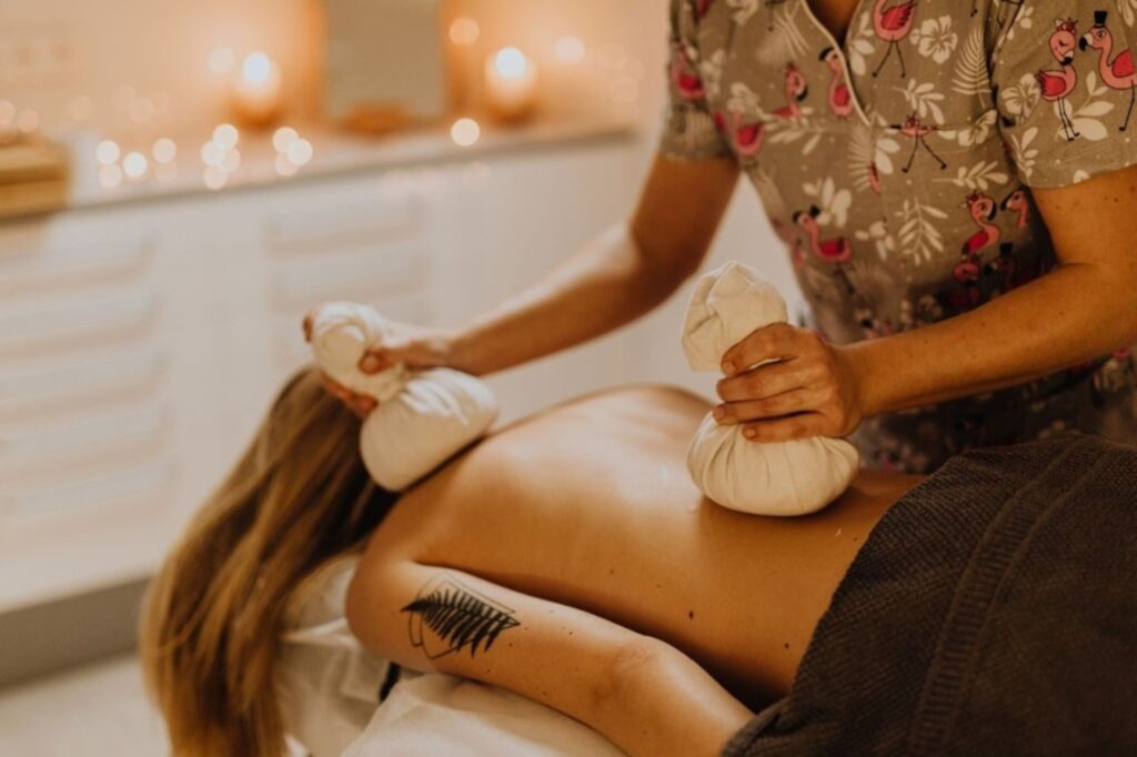 Woman experiencing serene Ayurvedic wellness ritual at Dubai spa Ayurvedic beauty rituals holistic glow radiant