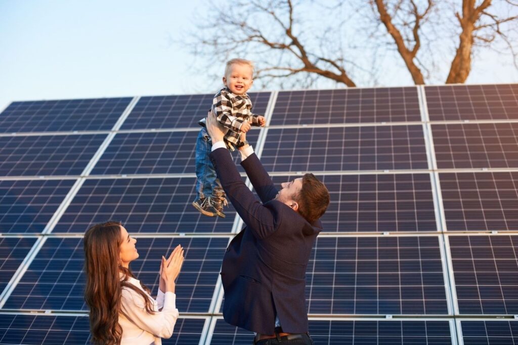 Family reviewing reduced electricity bills at home solar power renewable energy sustainable savings