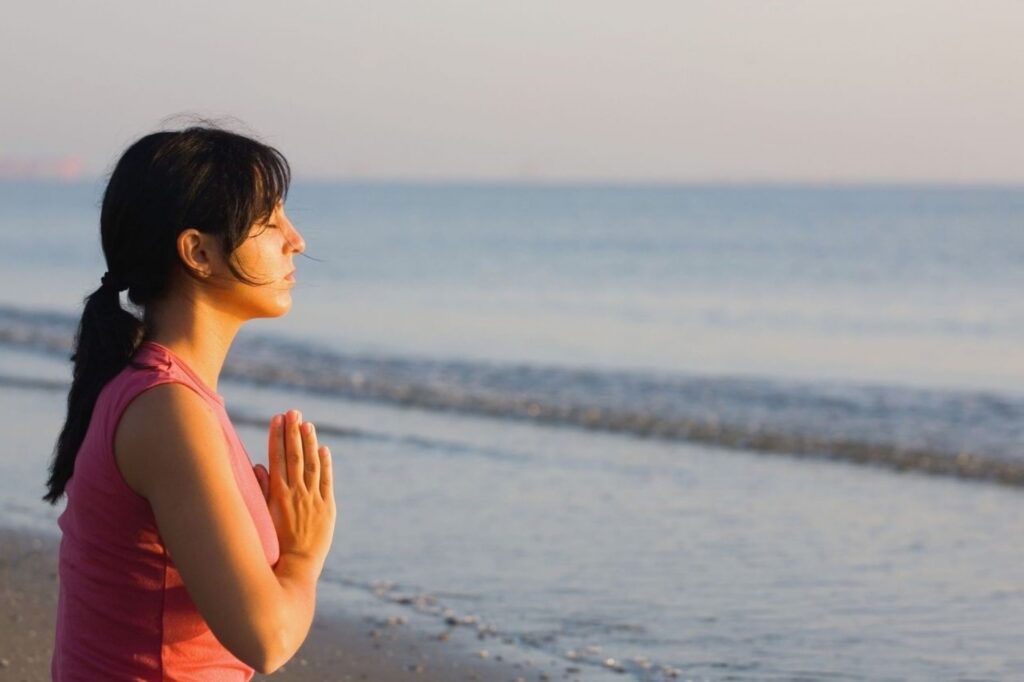 Sunset beach meditation at Palm Jumeirah digital detox destinations like The Retreat Palm and Anantara Resort, showcasing screen-free coastal wellness experiences for disconnecting from technology stress