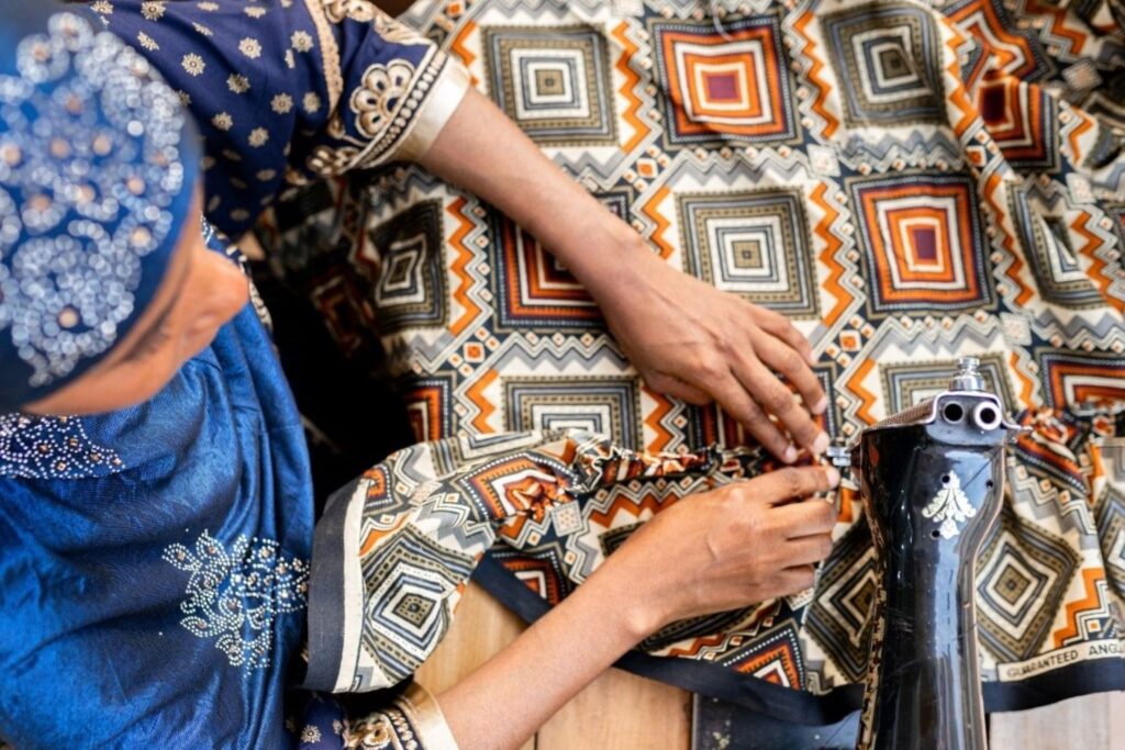 Sustainable party wear featuring traditional Middle Eastern artisan embroidery and deadstock fabrics, representing Dubai's ethical luxury fashion combining heritage craftsmanship with eco-friendly materials