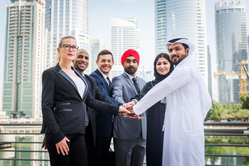 Property laws Dubai 2026 Investors celebrating successful Dubai property laws compliant real estate transaction
