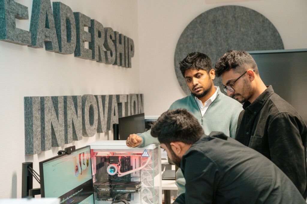 Startup team collaborating in Dubai freezone technology hub with modern business infrastructure