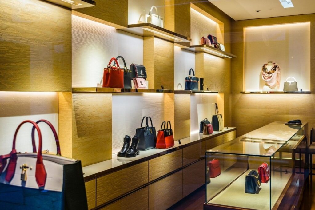 Luxury fashion products displayed in Dubai retail store representing high-end brand performance and sales