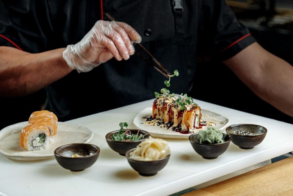 Food festival celebrity chef preparing gourmet dishes showing Dubai culinary experiences and dining events