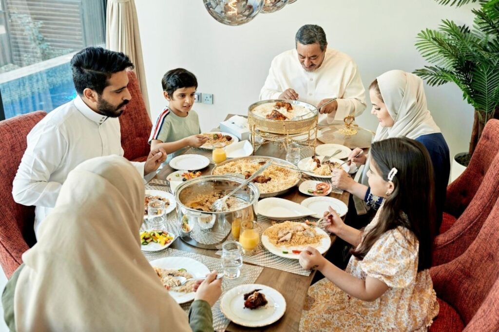 Family dining at Dubai restaurant during Eid Fitr demonstrating hospitality and retail business growth