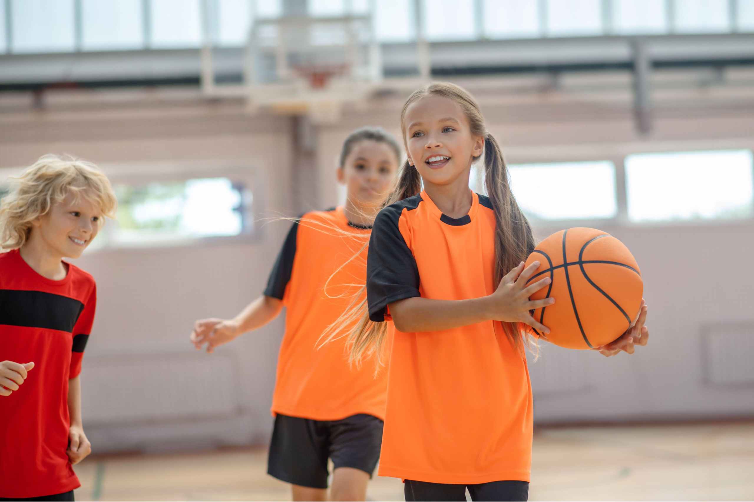 kids playing basket at Dubais popular indoor sports venues during summer