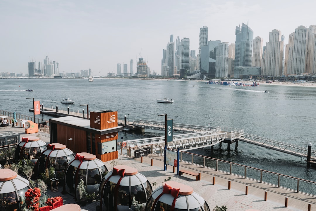 A multicultural family from Dubai's expat communities sharing a meal at a neighbourhood cafe