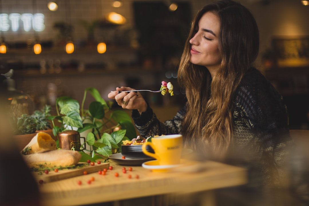 A health-conscious woman enjoys a gluten-free dining experience at a wellness café in Dubai