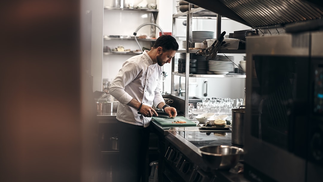 A chef preparing global cuisine in a Dubai restaurant, showing how the city's multinational workforce shapes its food culture