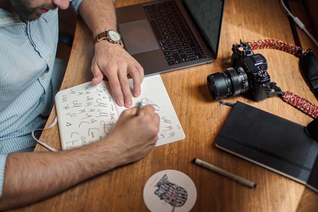 A male designer working on a digital submission for open-call art competitions in the UAE