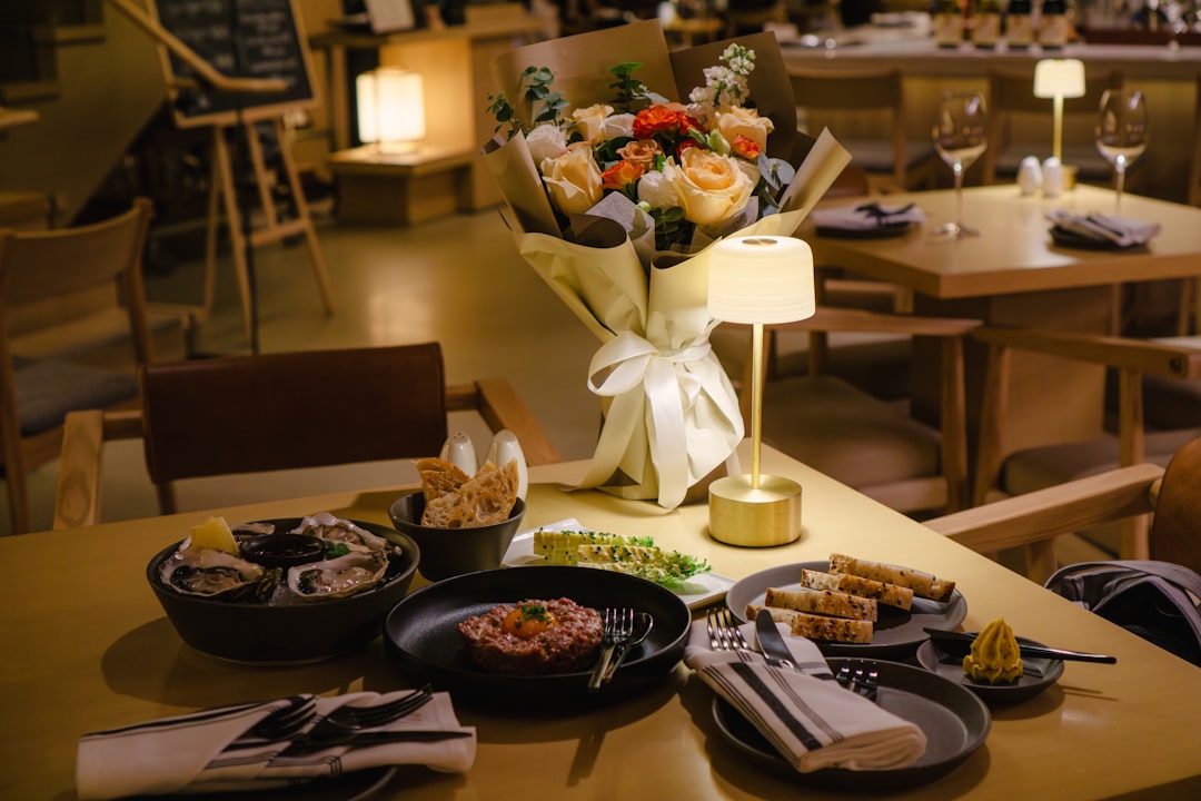 A couple enjoys an intimate multi-course dinner at a seasonal summer menus Dubai restaurant