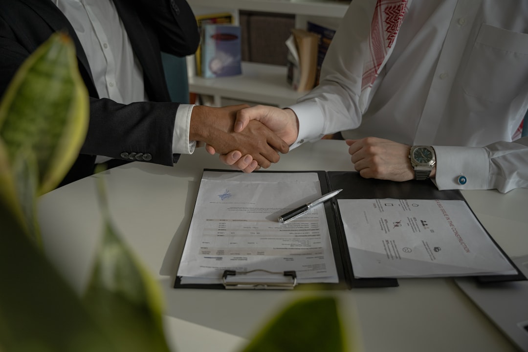 An entrepreneur signing a cross-border business agreement in Dubai, confident in the enforcement framework provided.