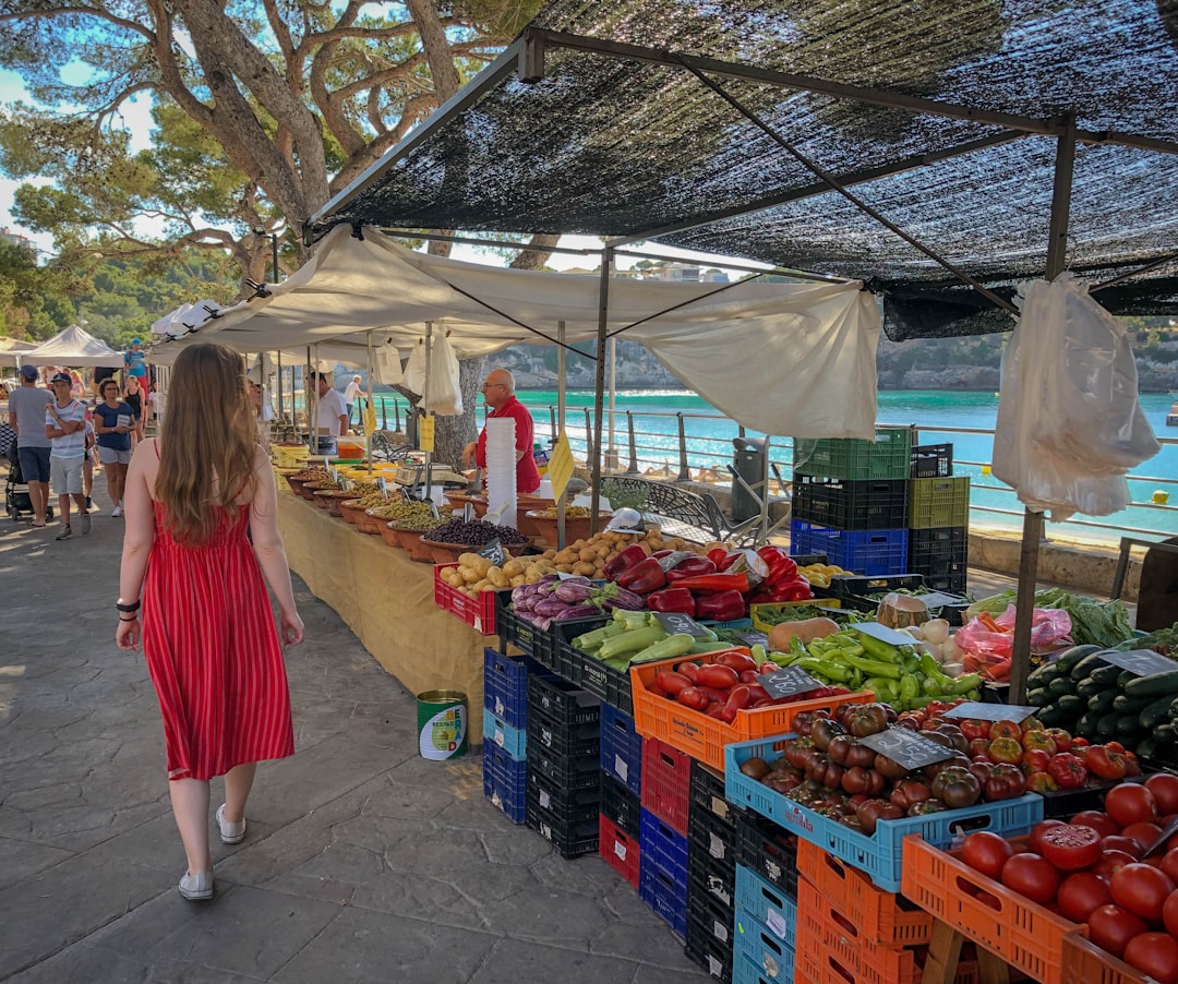 A family browses local honey and fruit at one of Dubai's most popular farmers markets on a weekend morning