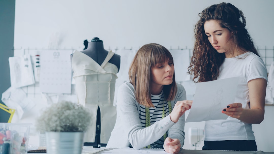 A fashion designer working in a Dubai studio, showing how the city's multinational workforce influences its fashion industry