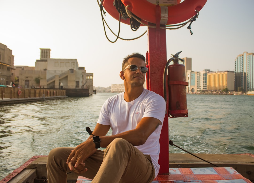 A traveler standing outside one of Dubai's most significant Dubai museums, the historic Al Fahidi Fort