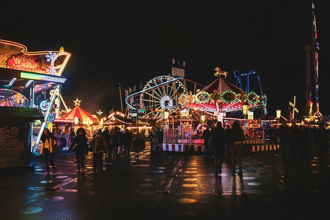 Children enjoying rides at the Carnaval zone during a Global Village Dubai evening visit