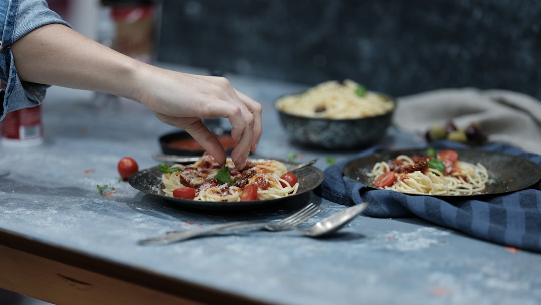 A woman preparing a healthy meal at home in Dubai to support her fitness reset nutrition plan