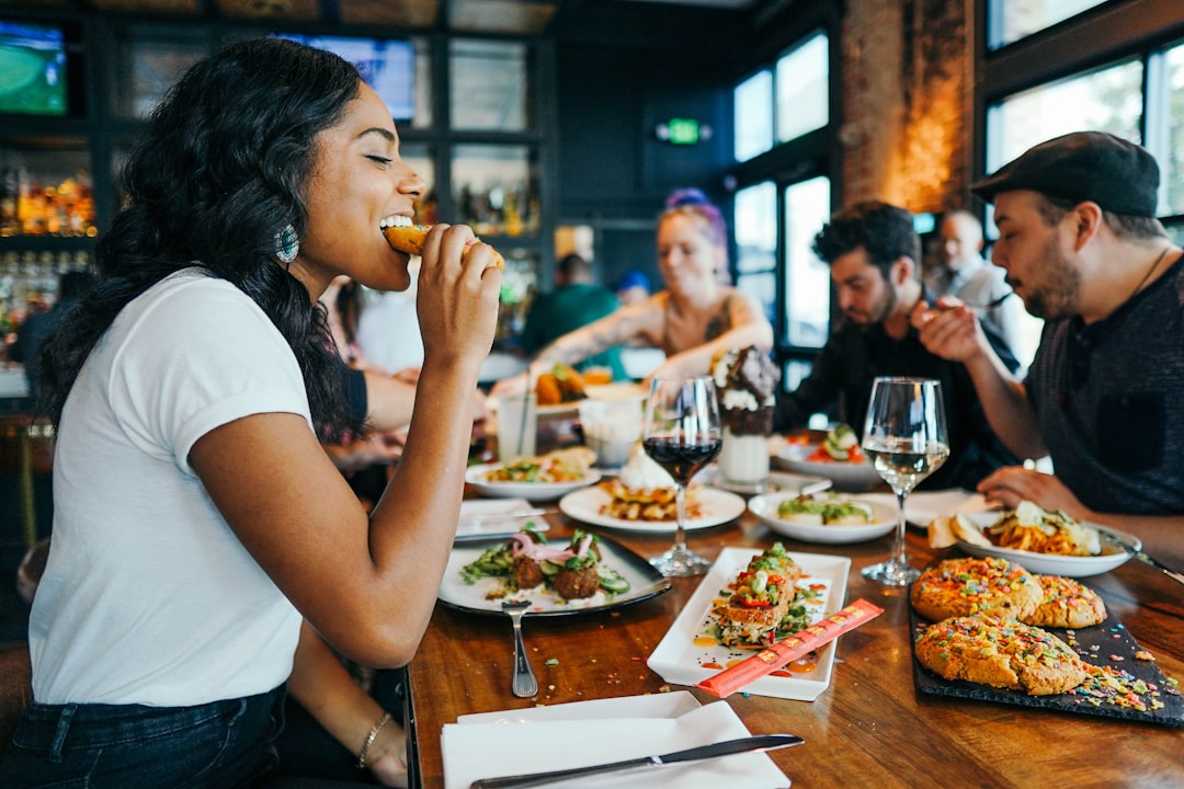 A group of diners sharing a multi-course tasting menu at a Singapore restaurant as seasonal Singapore menus