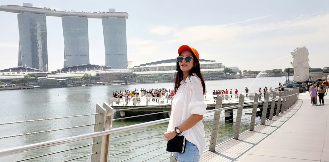 Woman testing humidity-proof makeup in Singapore heat