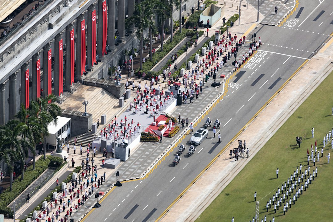Runner completing marathon training goal at Singapore's Padang finish line