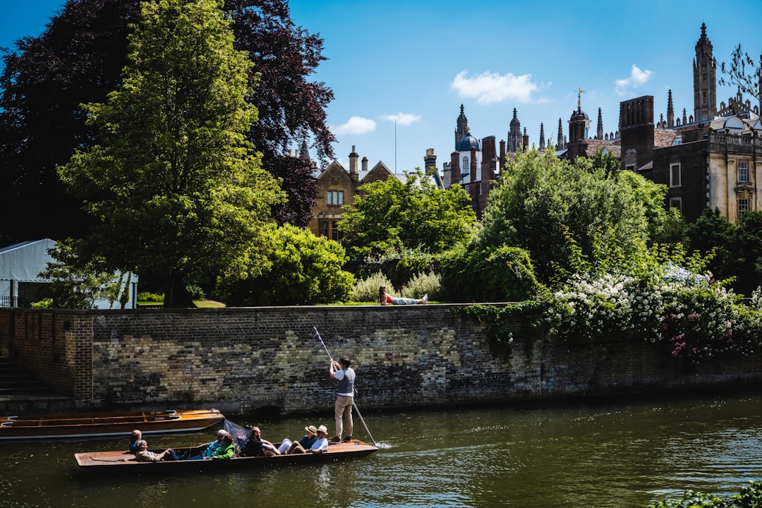 People enjoying a punting session on the River Cam, one of the most popular activities on day trips from London to Cambridge