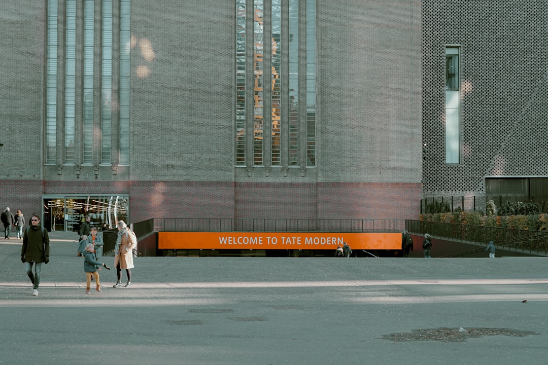 Visitors arrive at Tate Modern to see the Frida Kahlo blockbuster show, walking toward the gallery entrance on Bankside